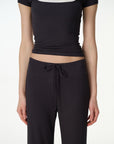 black high-rise wide-leg lounge pants, on model, styled view