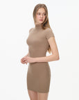 beige mock neck fitted mini dress, on model, side view
