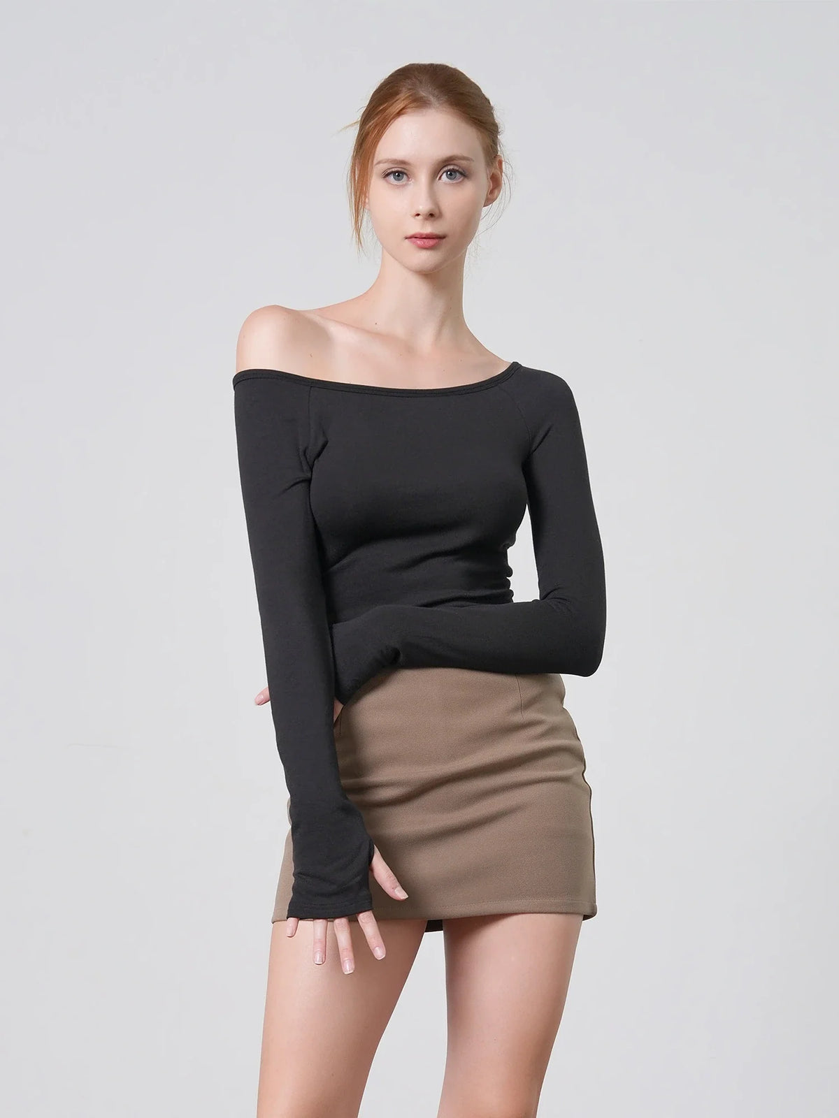 Model wearing the HAE Multi-wear Long Sleeve Top off the shoulder