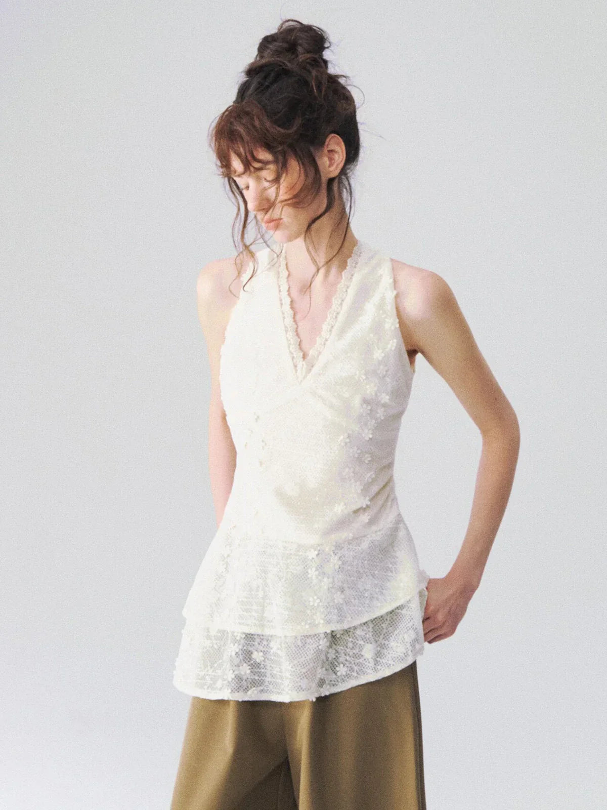 Model wearing the HAE Floral Lace V-Neck Peplum Top