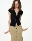 black ruched button-front short sleeve top, on model, styled view