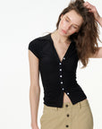 black ruched button-front short sleeve top, on model, full-length view