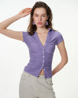purple ruched button-front short sleeve top, on model, styled view
