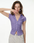 purple ruched button-front short sleeve top, on model, full-length view